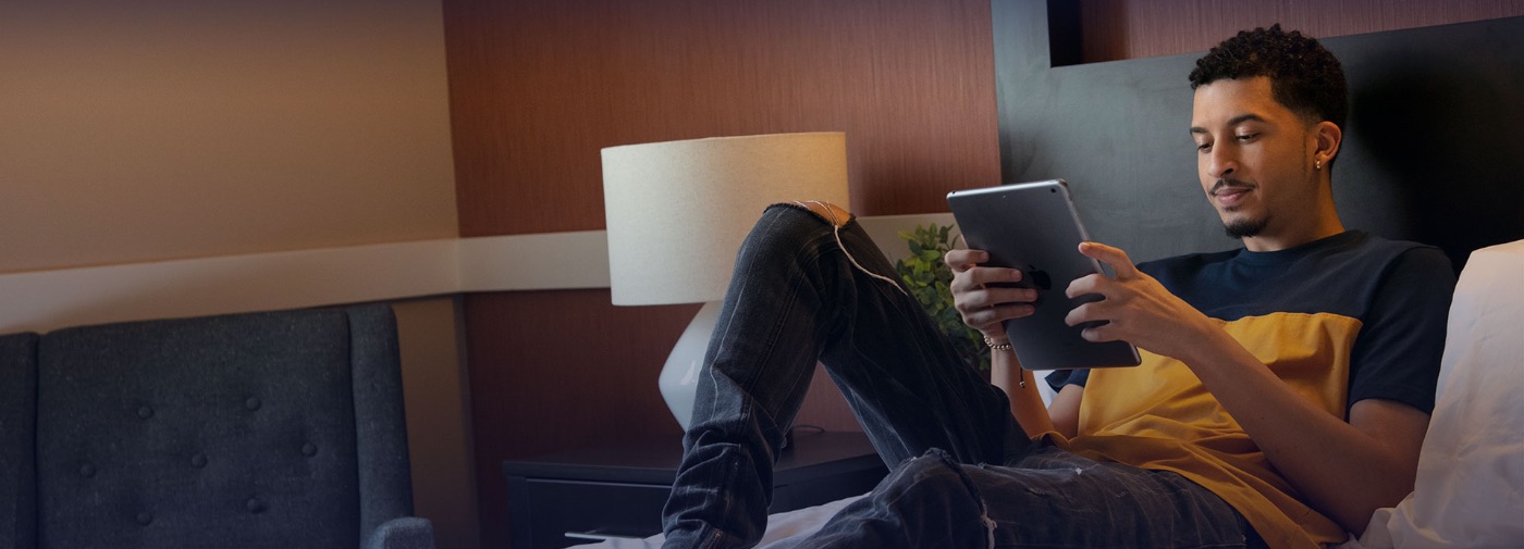 Patient at Sunrise Detox Duluth reading on his bed
